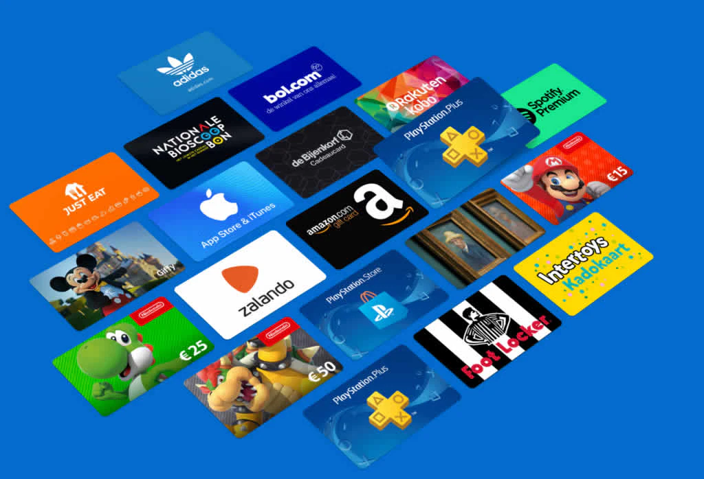 A collection of various gift cards on a blue background, featuring brands like Adidas, Spotify, PlayStation, Nintendo, Just Eat, Amazon, and more. Each card showcases its iconic logo and colors. Buy gift cards and prepaid airtime with crypto for a modern touch to your gifting experience. found at Refillarena